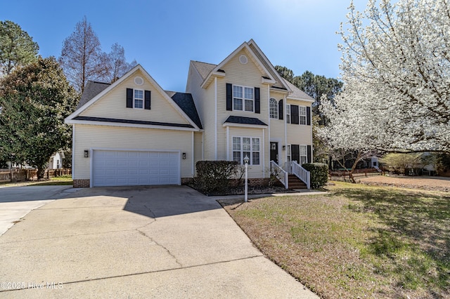 traditional-style home featuring driveway and a front lawn