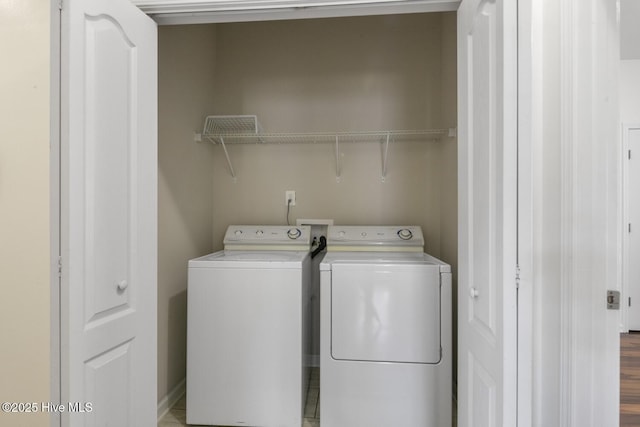 washroom with laundry area and washer and clothes dryer