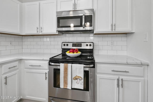 kitchen with white cabinetry and appliances with stainless steel finishes