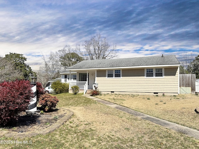 ranch-style house with crawl space, covered porch, a front yard, and fence