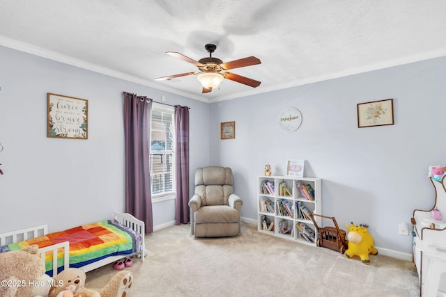 bedroom featuring baseboards, crown molding, carpet, and a ceiling fan