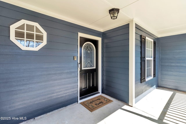 entrance to property featuring a porch