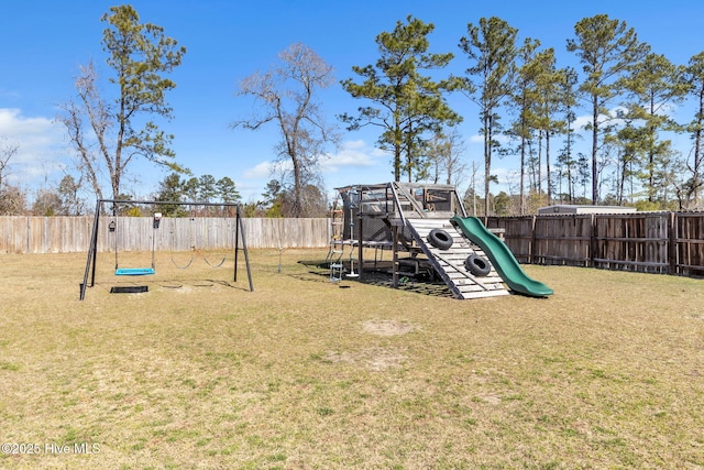 view of playground featuring a yard and a fenced backyard