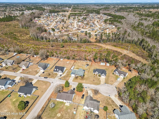 birds eye view of property with a residential view