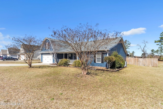 single story home with concrete driveway, a front lawn, and fence