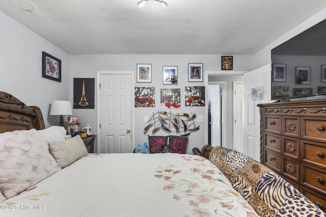 bedroom featuring a textured ceiling