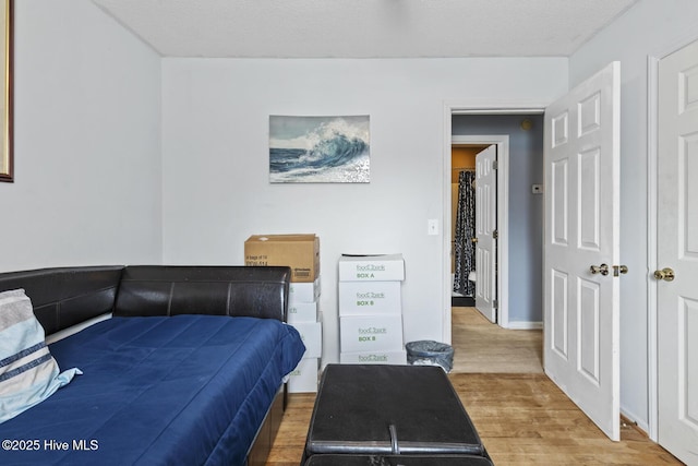 bedroom with wood finished floors