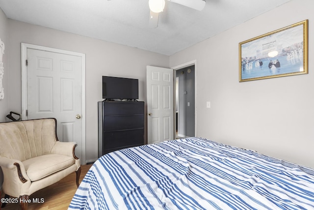 bedroom with wood finished floors and ceiling fan