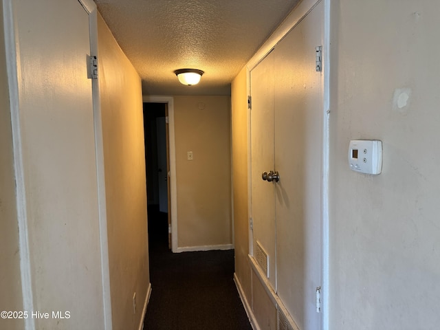 1122 E Stewart Cir, Wilmington, NC 28405 - hall featuring a textured ceiling and baseboards