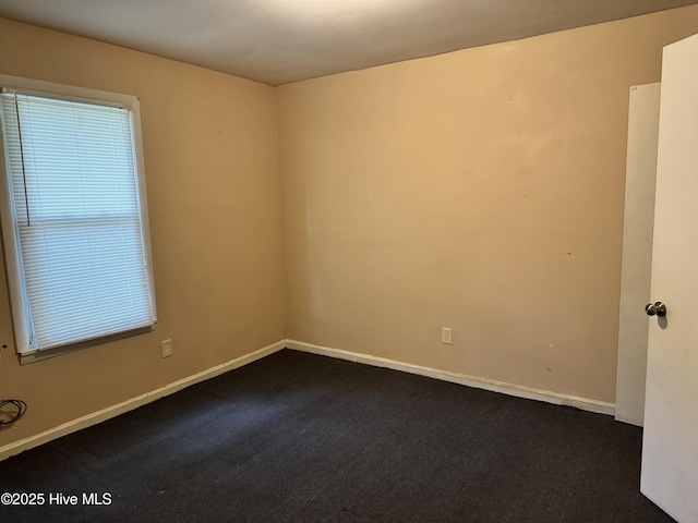 1122 E Stewart Cir, Wilmington, NC 28405 - empty room with dark colored carpet and baseboards