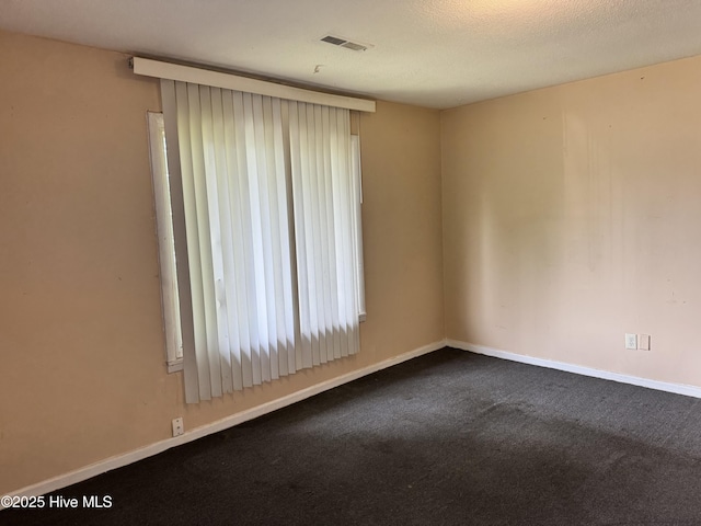 1122 E Stewart Cir, Wilmington, NC 28405 - spare room featuring dark colored carpet and baseboards