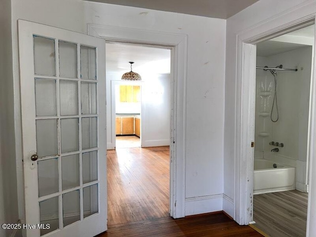 hall with wood finished floors