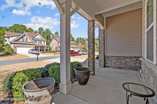 view of patio / terrace featuring a porch and a residential view