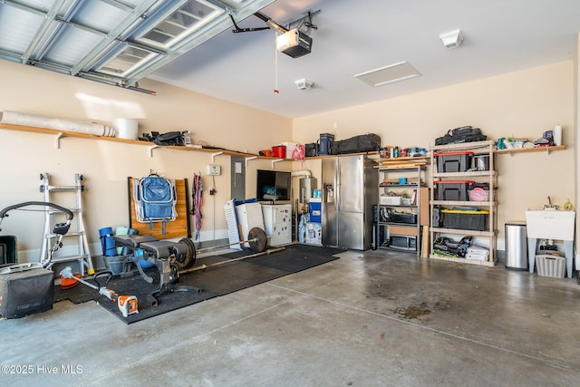 garage with electric panel and a garage door opener