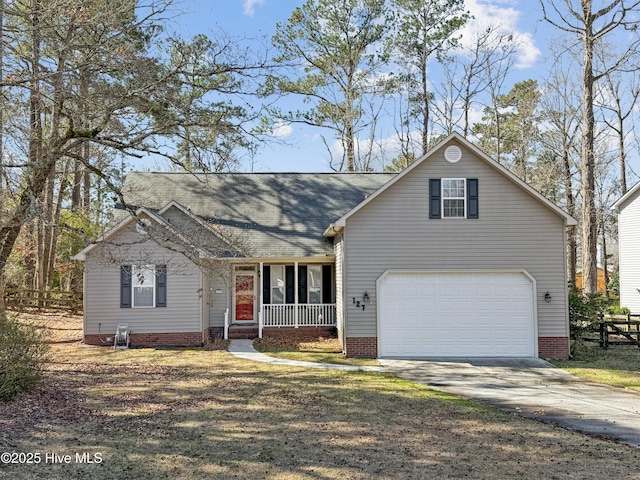 traditional-style home featuring a porch and concrete driveway