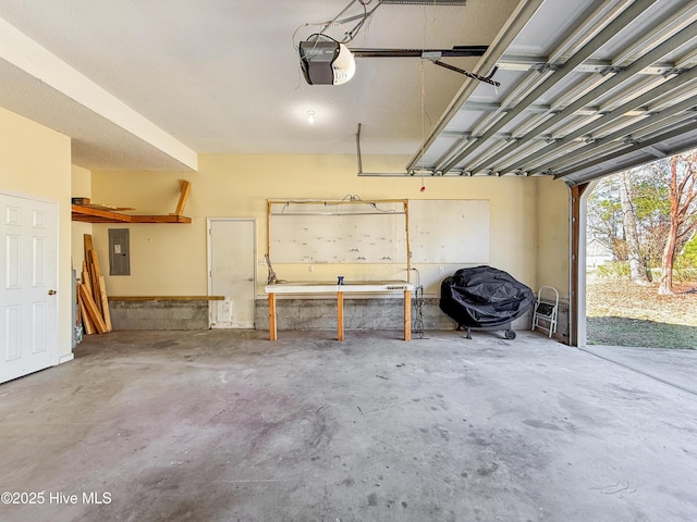 garage featuring electric panel and a garage door opener