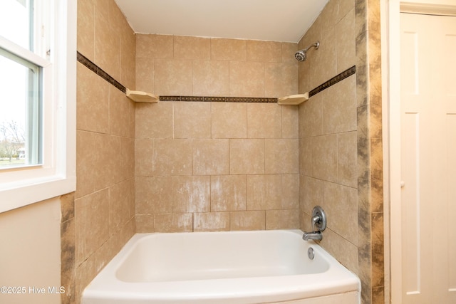 bathroom featuring washtub / shower combination