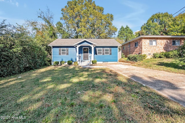 single story home with crawl space, driveway, and a front lawn