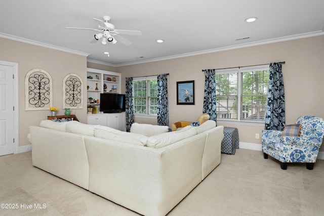 living area with carpet, ceiling fan, baseboards, visible vents, and crown molding
