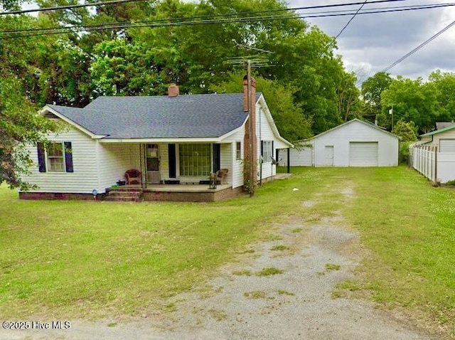 ranch-style home featuring driveway, a porch, a chimney, a front lawn, and a garage