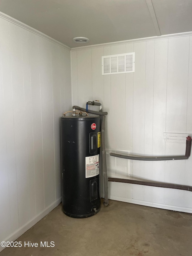 utility room with water heater and visible vents