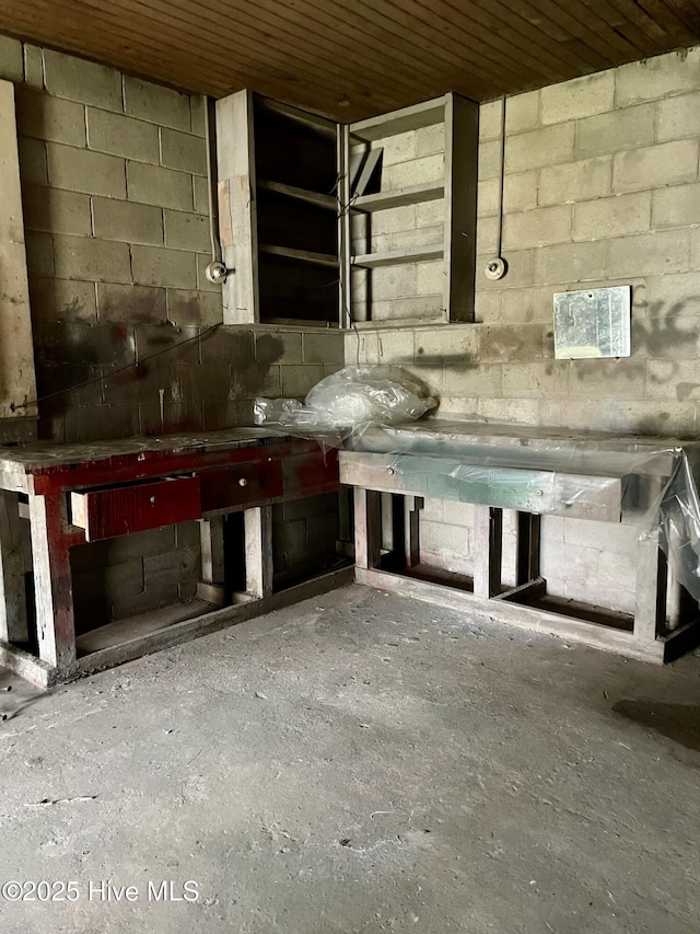 interior space featuring concrete block wall