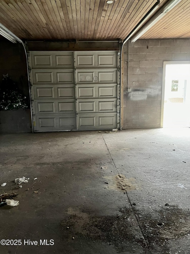 garage with concrete block wall
