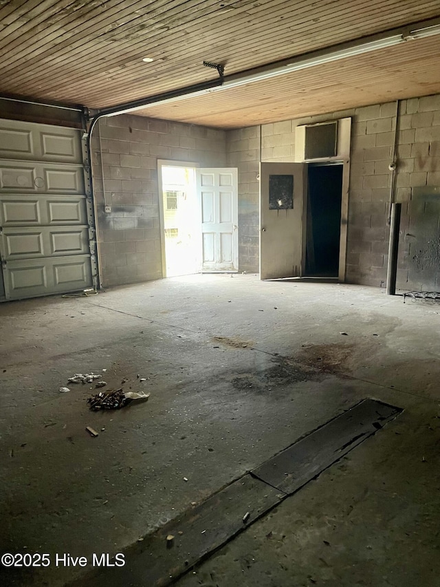 garage with concrete block wall