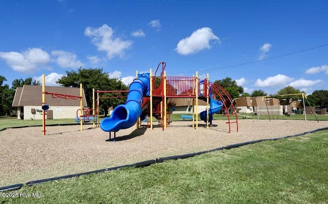 community play area with a lawn