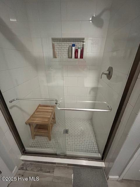 full bathroom featuring a stall shower