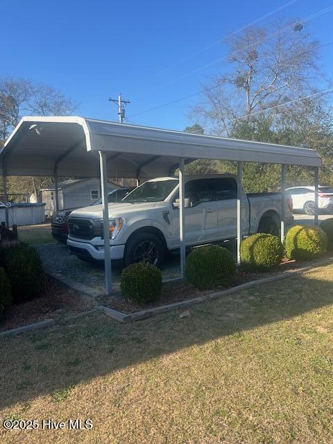 view of parking with a carport