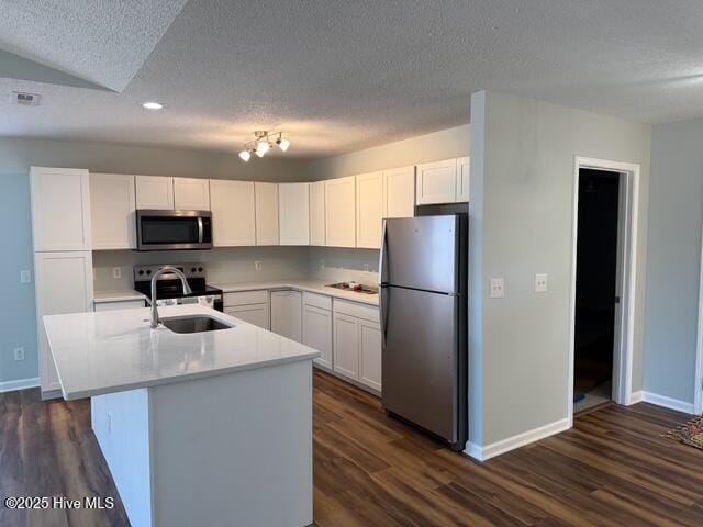 kitchen featuring a sink, dark wood-style floors, stainless steel appliances, white cabinets, and light countertops