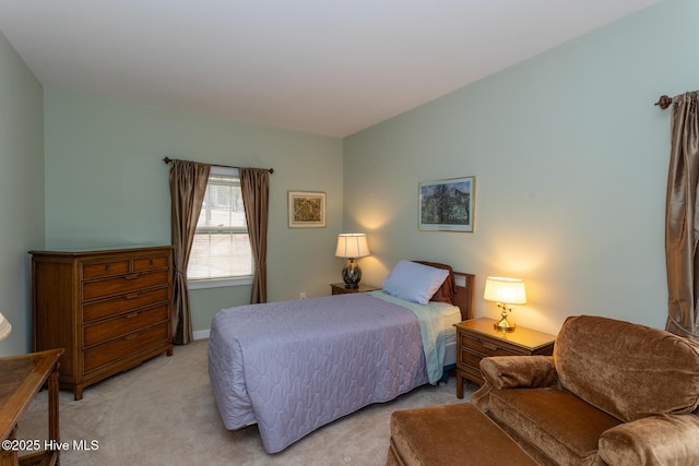 bedroom featuring light carpet