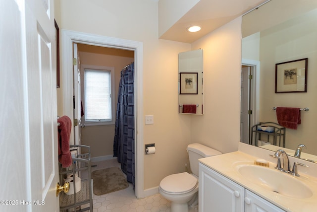 full bath featuring tile patterned floors, toilet, recessed lighting, baseboards, and vanity