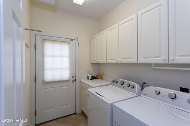 laundry room with washer and dryer and cabinet space