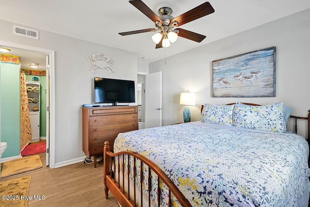 bedroom with visible vents, ceiling fan, baseboards, and wood finished floors