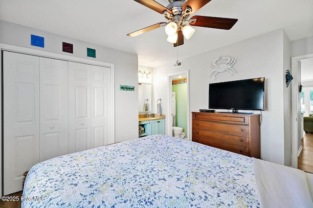 bedroom with a ceiling fan, a closet, and connected bathroom