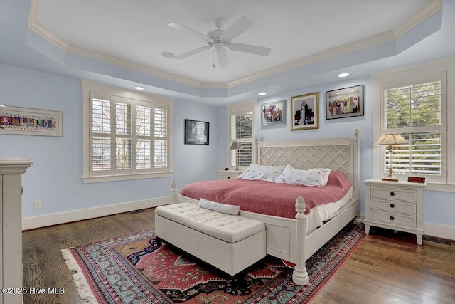108 Cottage Walk, Hampstead, NC 28443 - bedroom featuring a tray ceiling, wood finished floors, and baseboards