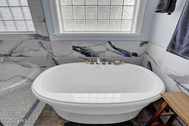 108 Cottage Walk, Hampstead, NC 28443 - full bathroom featuring a soaking tub, plenty of natural light, and tile walls