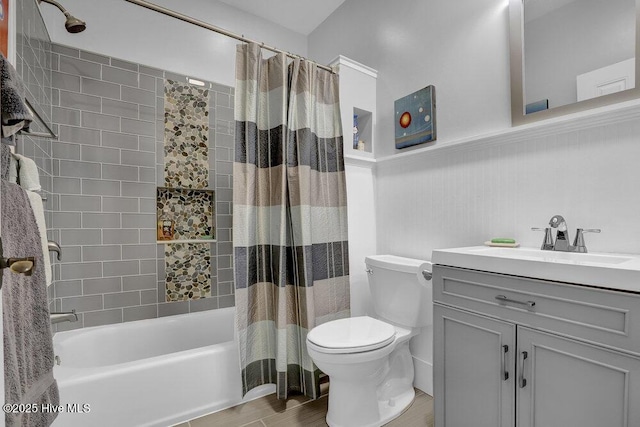 full bathroom with toilet, shower / bath combo, wainscoting, wood finished floors, and vanity