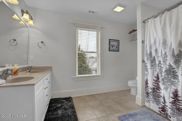 108 Cottage Walk, Hampstead, NC 28443 - full bathroom featuring a sink, visible vents, double vanity, and tile patterned floors