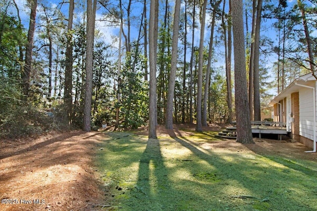 view of yard with a wooden deck