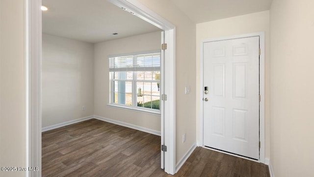 entryway featuring visible vents, baseboards, and dark wood-style floors