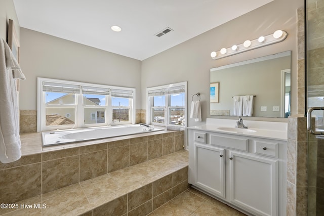 full bathroom featuring vanity, visible vents, tiled shower, tile patterned floors, and a bath