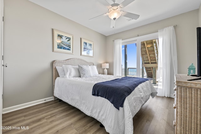 bedroom featuring visible vents, access to outside, wood finished floors, baseboards, and ceiling fan