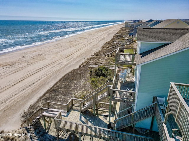 bird's eye view featuring a beach view and a water view