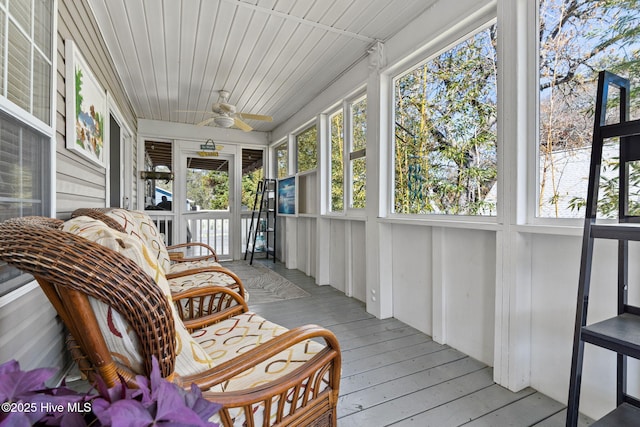 sunroom with a ceiling fan