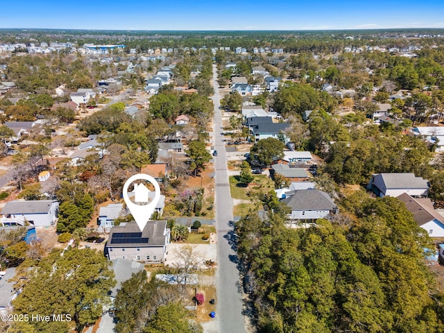 birds eye view of property with a residential view