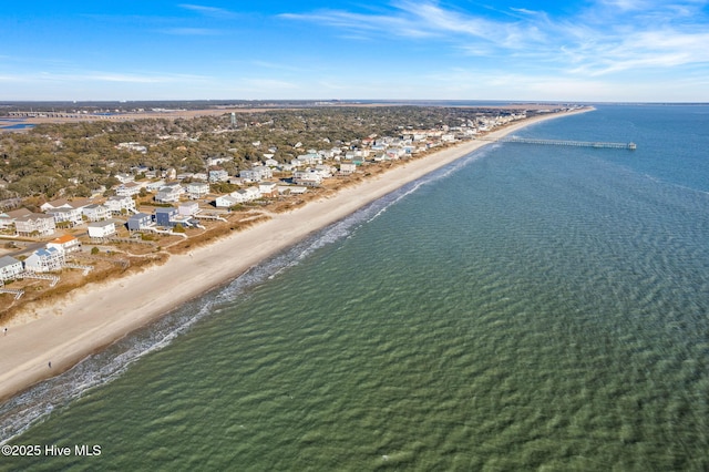 birds eye view of property featuring a water view and a view of the beach