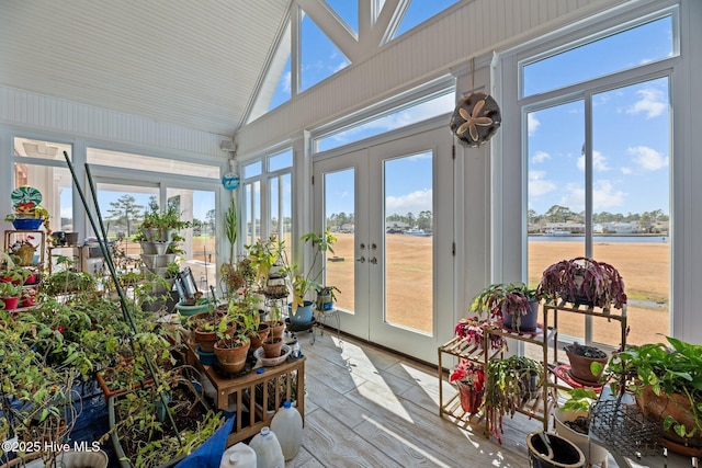 sunroom featuring plenty of natural light, french doors, and vaulted ceiling